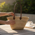 Handwoven Moroccan straw basket with simple leather handles