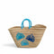 Handwoven Moroccan straw basket with embroidered shell motif