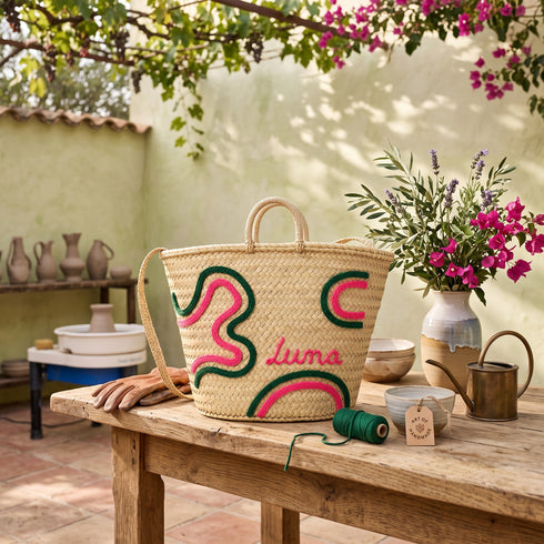 Handwoven Moroccan Palm Leaf Basket with Pink & Green Embroidery