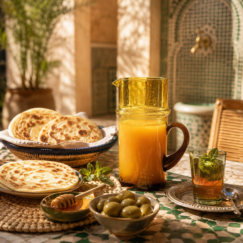 Complete your table service with an Art of handmade Moroccan Beldi glass pitcher.