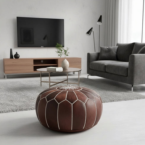 Enhance your living space with an Art of handmade Moroccan leather pouf.