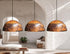 Illuminate your dining space with a beautiful Art of handmade rustic copper pendant set.