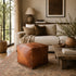 Anchor your room with a sleek, handmade Moroccan square leather pouf.