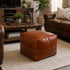 Anchor your room with a sleek, handmade Moroccan square leather pouf.