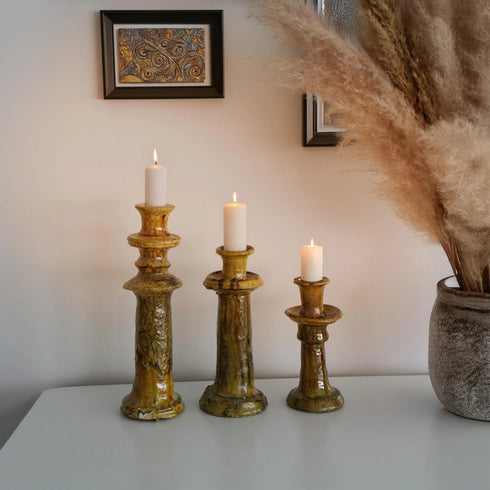 Illuminate your living spaces with our Art of handmade Tamegroute pottery candlestick set.