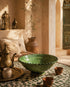 Elevate your dining table centerpiece with our handmade Moroccan Tamegroute stemmed fruit bowl, a timeless piece of artisan pottery crafted in Morocco.