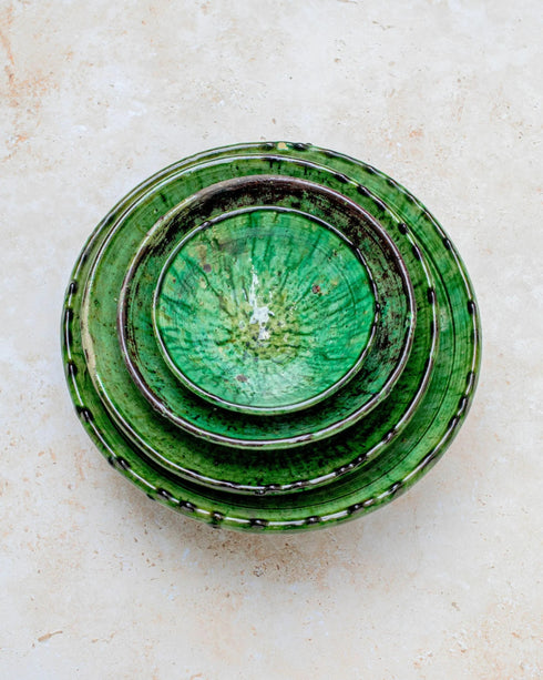 Elevate your dining table centerpiece with our handmade Moroccan Tamegroute stemmed fruit bowl, a timeless piece of artisan pottery crafted in Morocco.