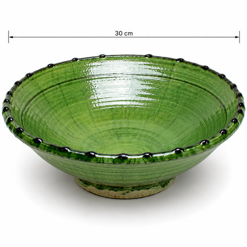 Elevate your dining table centerpiece with our handmade Moroccan Tamegroute stemmed fruit bowl, a timeless piece of artisan pottery crafted in Morocco.