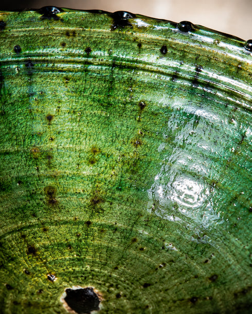 Elevate your dining table centerpiece with our handmade Moroccan Tamegroute stemmed fruit bowl, a timeless piece of artisan pottery crafted in Morocco.
