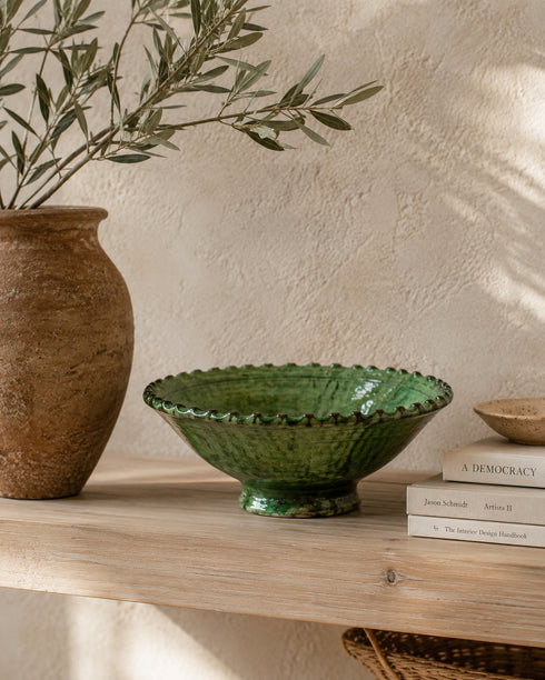 Elevate your dining table centerpiece with our handmade Moroccan Tamegroute stemmed fruit bowl, a timeless piece of artisan pottery crafted in Morocco.