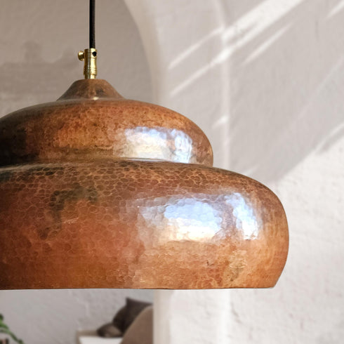 Brighten your home design with a stunning Art of handmade tiered copper pendant set.