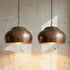 Brighten your kitchen island with a stunning Art of handmade vintage copper lamp set.