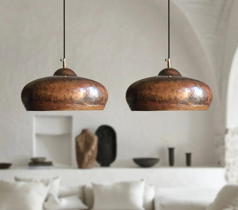 Illuminate your kitchen island with this rustic Art of handmade copper dome pendant.
