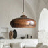 Illuminate your kitchen island with this rustic Art of handmade copper dome pendant.