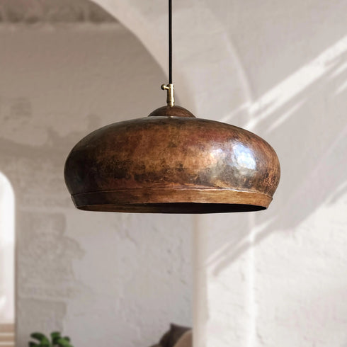 Illuminate your kitchen island with this rustic Art of handmade copper dome pendant.