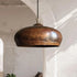 Illuminate your kitchen island with this rustic Art of handmade copper dome pendant.