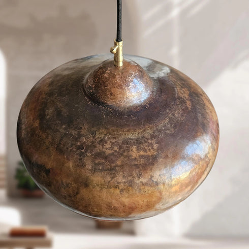 Illuminate your kitchen island with this rustic Art of handmade copper dome pendant.