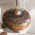 Illuminate your kitchen island with this rustic Art of handmade copper dome pendant.