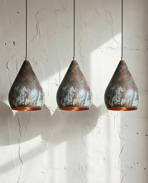 Illuminate your kitchen island with a rustic Art of handmade copper pendant light.
