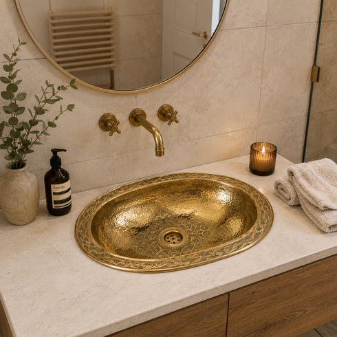 Elevate your bathroom countertop with an Art of handmade brass oval engraved sink.
