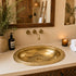 Elevate your bathroom countertop with an Art of handmade brass oval engraved sink.